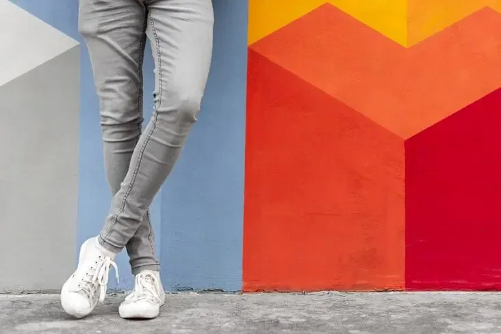 white sneakers and grey jeans