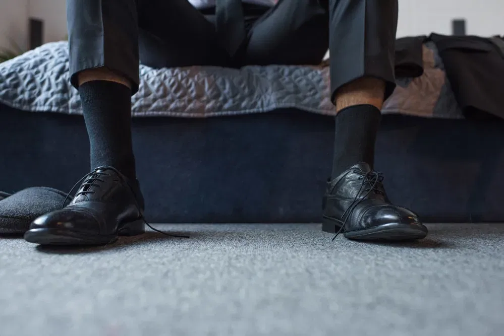 black shoes black socks too short 