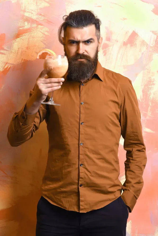 burnt orange shirt with black pants