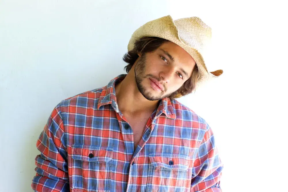 cowboy hat and long hair