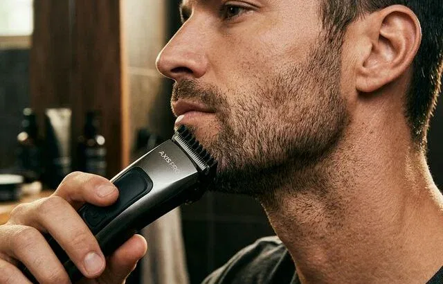 Man trimming 5 o'clock shadow stubble with precision trimmer