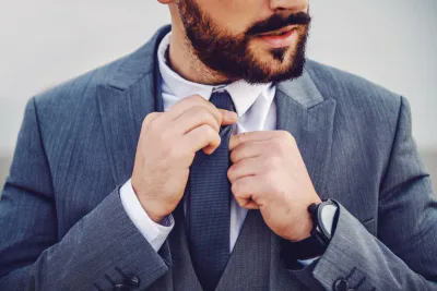 grey blazer and tie