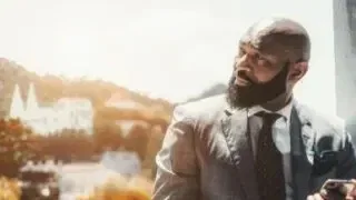 Bald Man In Grey Windowpane Suit Shutterstock Edited