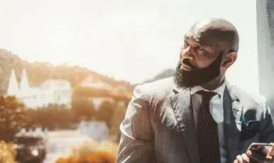 Bald Man In Grey Windowpane Suit Shutterstock Edited