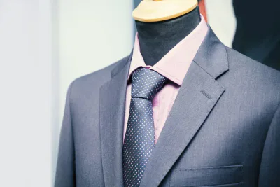 navy suit and pink shirt