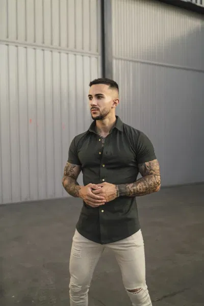 olive green shirt with white pants