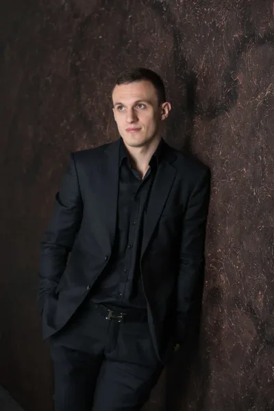 black shirt and pants with a black blazer