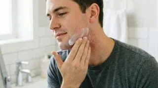 Man applying aftershave balm to prevent stubble rash