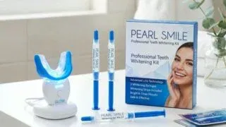 LED teeth whitening kit with gel syringes and whitening strips