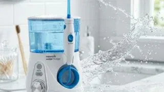 Waterpik water flosser on bathroom countertop